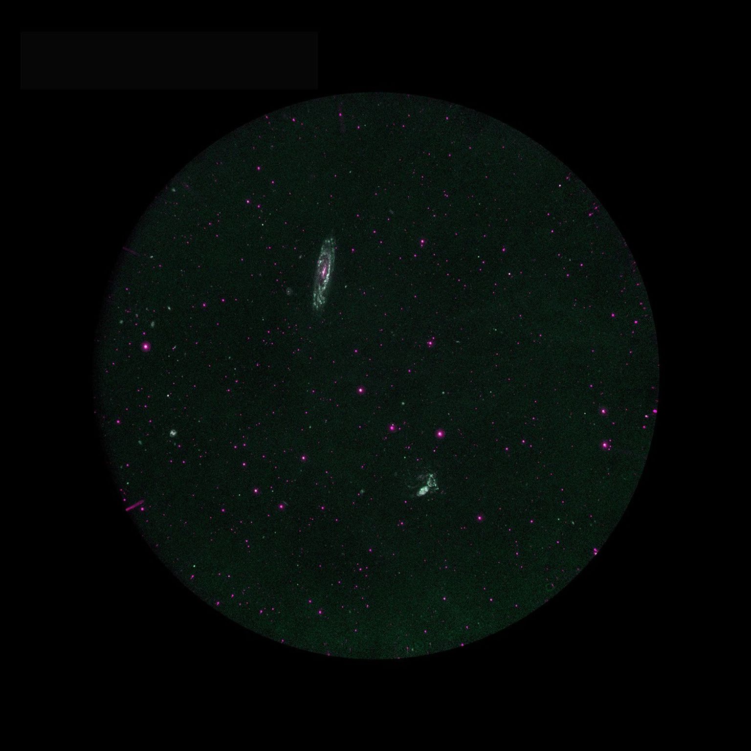 Galaxy Evolution Explorer observation of Stephan's Quintet and the nearby galaxy NGC 7331. Blue represents far ultraviolet, and red near ultraviolet. Stephan's quintet is an interacting group of galaxies.