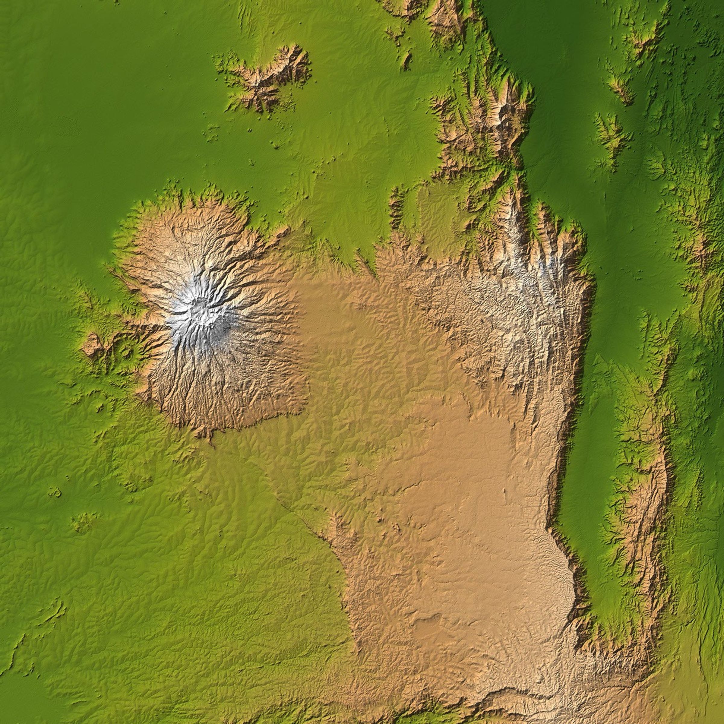 The striking contrast of geologic structures in Africa is shown in this shaded relief image of Mt. Elgon on the left and a section of the Great Rift Valley on the right as seen by NASA's Shuttle Radar Topography Mission.
