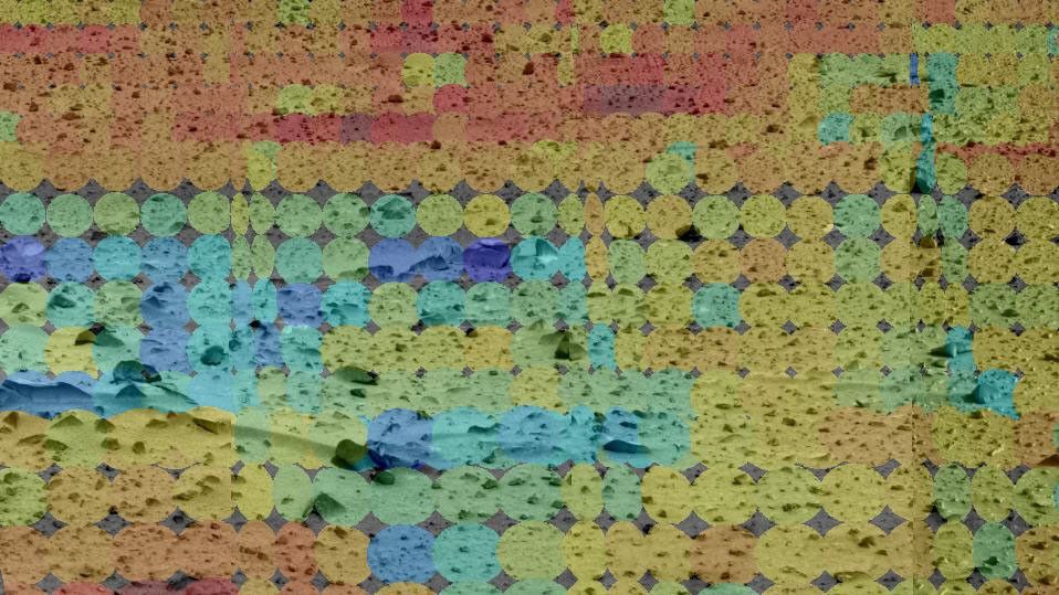 This image shows the martian terrain through the eyes of NASA's Mars Exploration Rover Spirit's mini-thermal emission spectrometer, an instrument that detects the infrared light, or heat, emitted by objects. Red represents warmer regions and blue, cool.