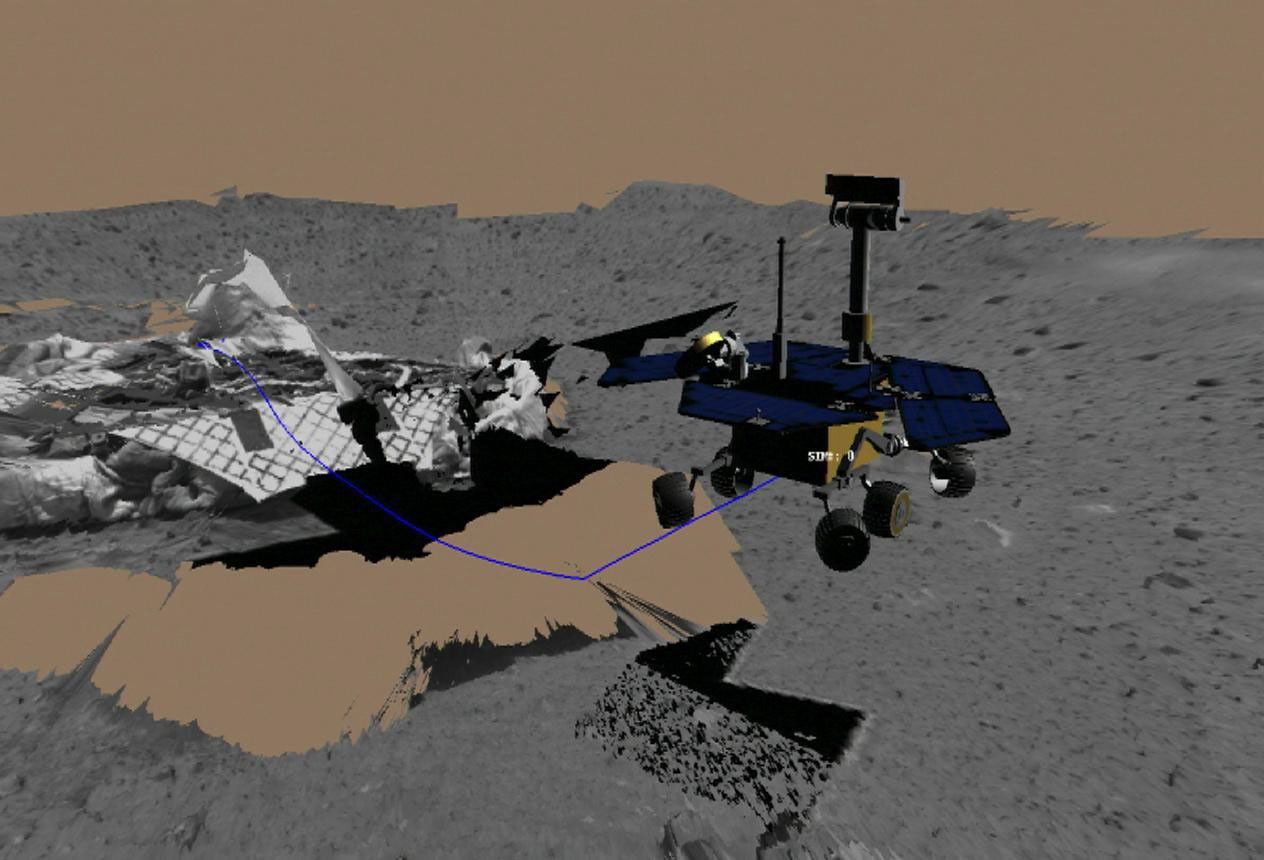 This image shows a screenshot from the software used by engineers to test and drive NASA's Mars Exploration Rover Spirit. The rover drove toward its first rock target, a mountain-shaped rock called Adirondack.