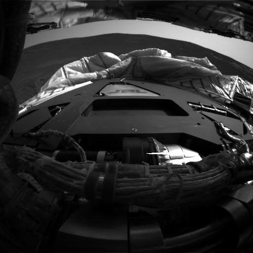 This image taken by NASA's Mars Exploration Rover Opportunity's hazard-identification camera shortly after the rover successfully landed at Meridiani Planum shows the view from behind the rover.