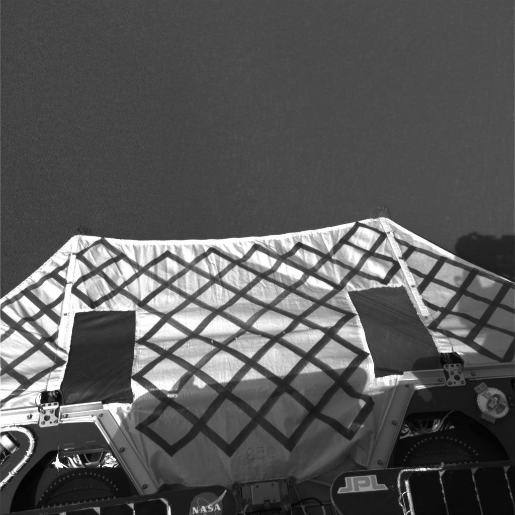 NASA's Mars Exploration Rover Opportunity shows the rover's egress aid touching the martian soil at Meridiani Planum, Mars.