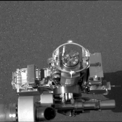 NASA's Mars Exploration Rover Opportunity shows the rover's rock abrasion tool, also known as 'rat' (circular device in center), located on its instrument deployment device, or 'arm.'