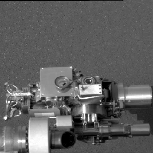 NASA's Mars Exploration Rover Opportunity shows the rover's rock abrasion tool, also known as 'rat' (circular device in center), located on its instrument deployment device, or 'arm.'