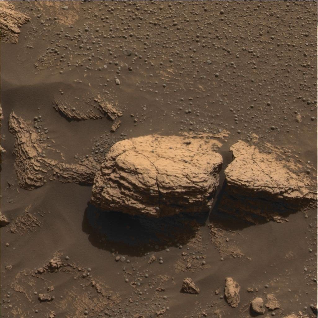 This red-hued color image taken by NASA's Mars Exploration Rover Opportunity shows the part of the rock outcrop dubbed Stone Mountain at Meridiani Planum, Mars.