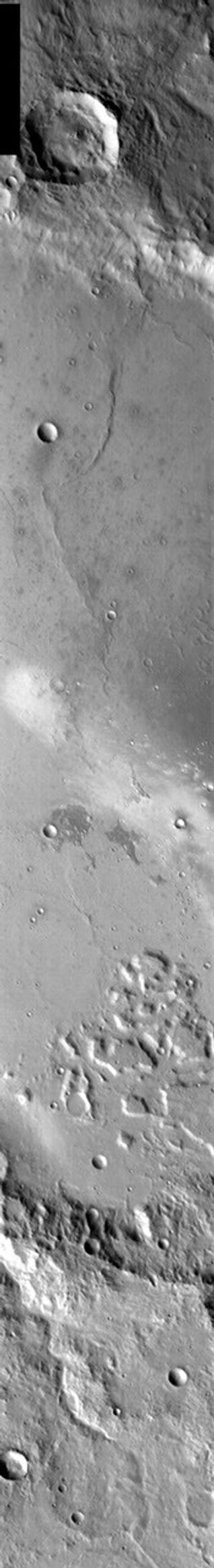 This image from NASA's 2001 Mars Odyssey released on Jan 16, 2004 shows the central part of Gusev Crater, including the landing site of Mars Exploration Rover Spirit in the white streak caused by dust devils.