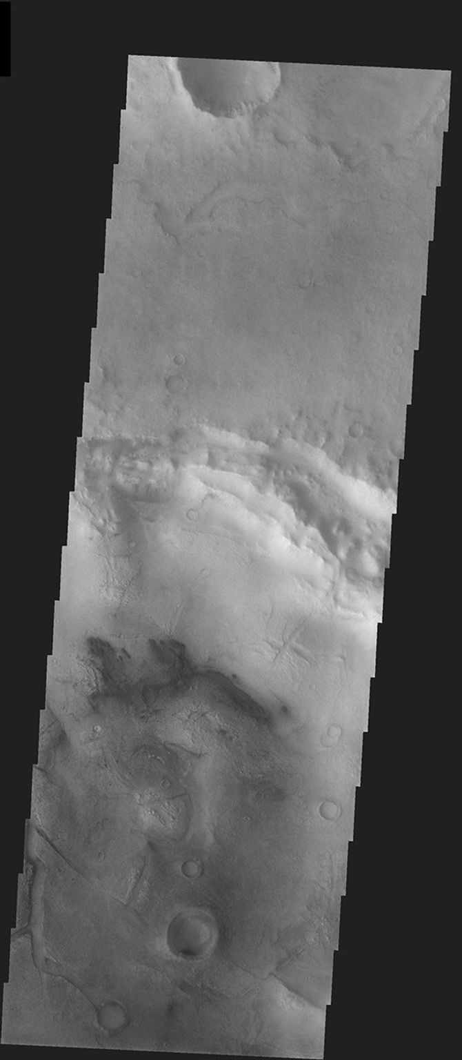 This image captured on 23 August 2003 by NASA's 2001 Mars Odyssey, shows West Meridiani Crater, while Mars Exploration Rover Oppotunity was on its way to Mars.