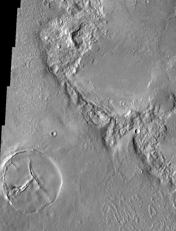 This image, part of an images as art series from NASA's 2001 Mars Odyssey released on Feb 2, 2004 shows an interesting symbol in the bottom-left corner that looks like a peace sign on Mars.