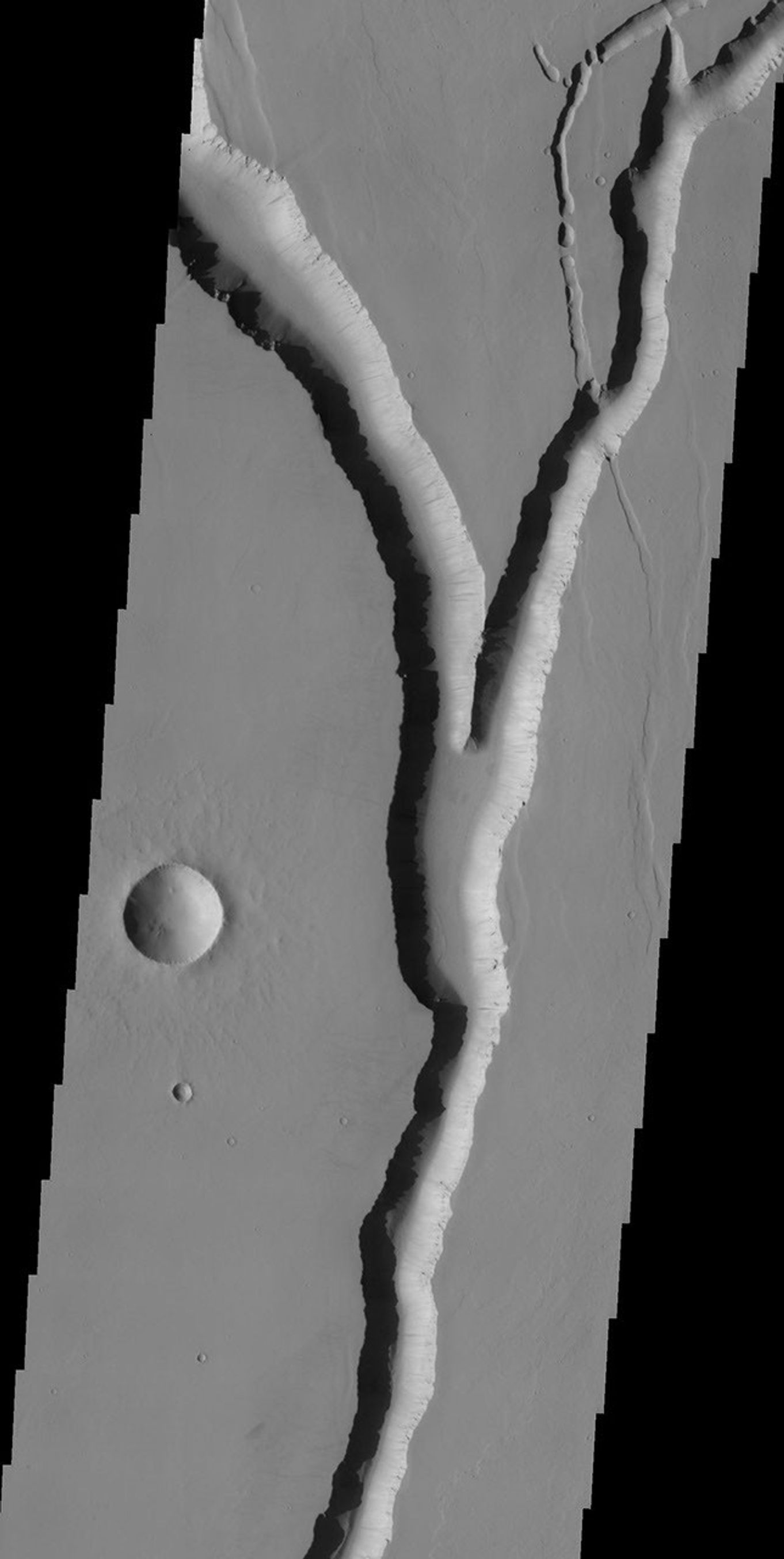 This image, part of an images as art series from NASA's 2001 Mars Odyssey released on Feb 3, 2004 shows a branching valley with nearby crater bringing to mind many calm landscape pictures showing a moonrise behind a tree.