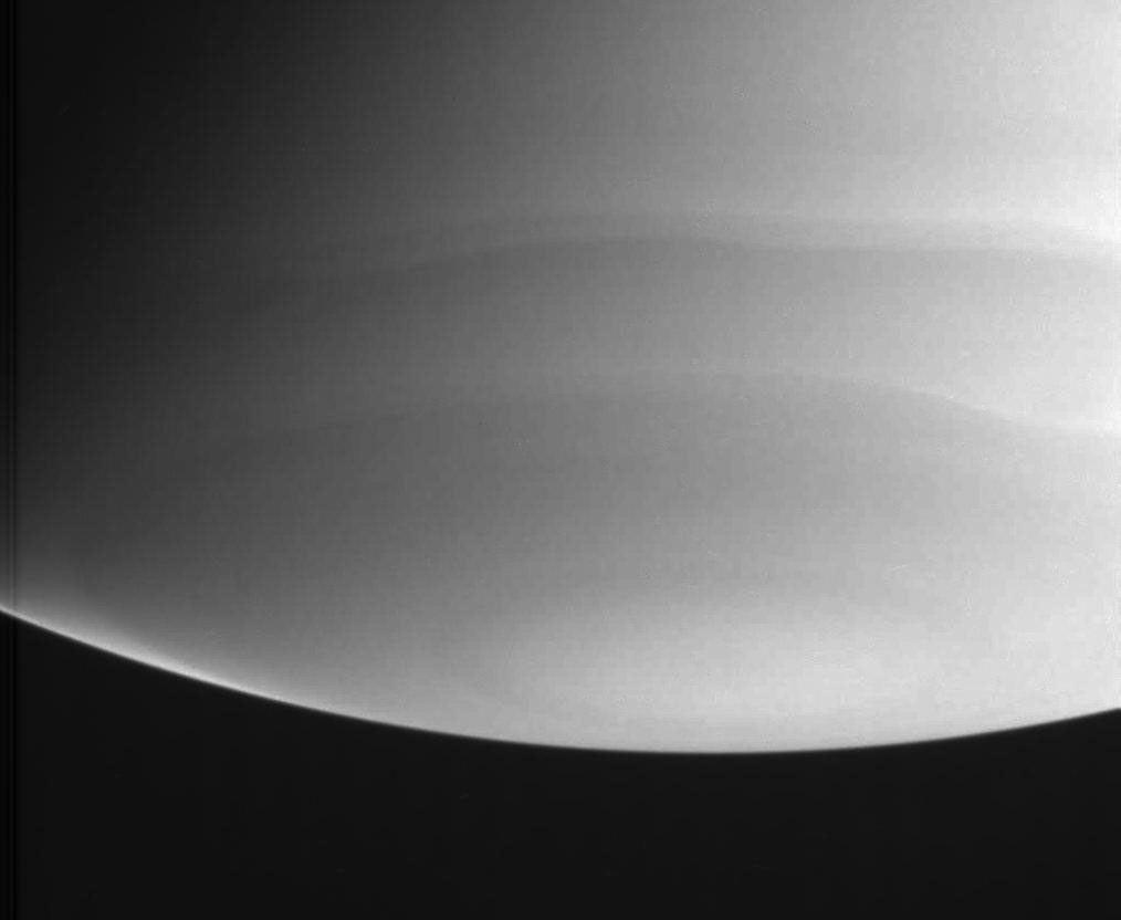 This ultraviolet view captured by NASA's Cassini spacecraft shows wavy cloud bands near Saturn's south polar region.
