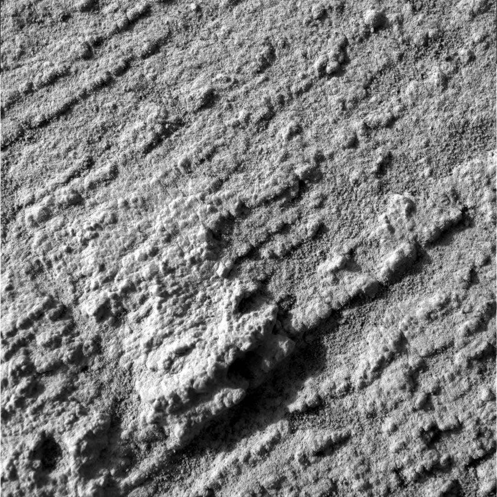 This microscopic image of 'Flatrock,' taken on NASA's Mars Exploration Rover Opportunity's 43rd sol on Mars, is representative of the science team's goal at the rock outcrop under investigation at Meridiani Planum.