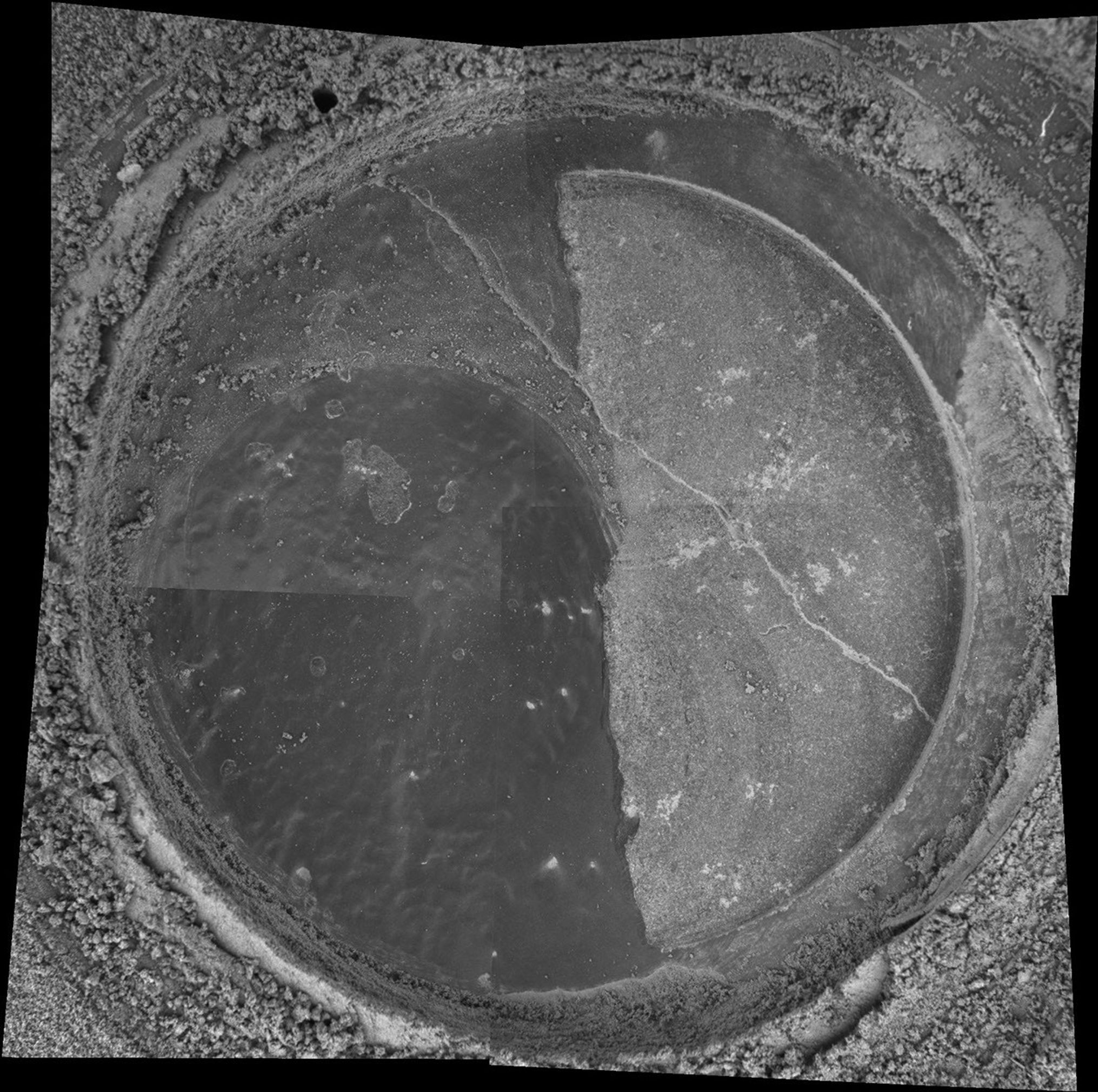 NASA's Mars Exploration Rover Spirit took the four images that make up this mosaic that reveals the drilled surface of the target called 'New York' on the rock dubbed 'Mazatzal.'