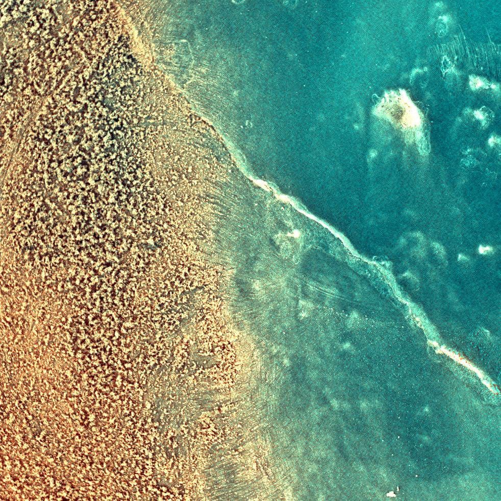 This enhanced-color image NASA's Mars Exploration Rover Spirit shows the rock dubbed 'Mazatzal' after a portion of its surface was brushed clean by the rover's rock abrasion tool. The reddish material on the left is the original dust coating.