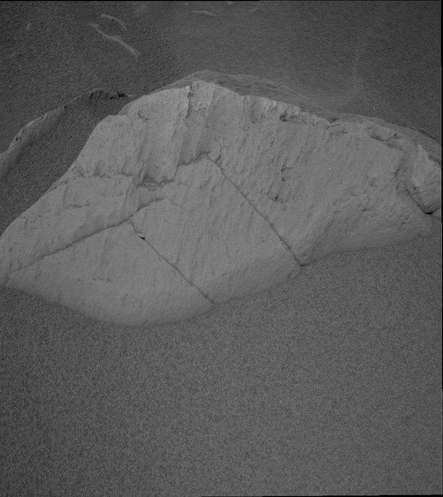 NASA's Mars Exploration Rover Spirit took this panoramic camera image showing the rock dubbed 'Route 66.' The rock is light-toned and has a scalloped surface.