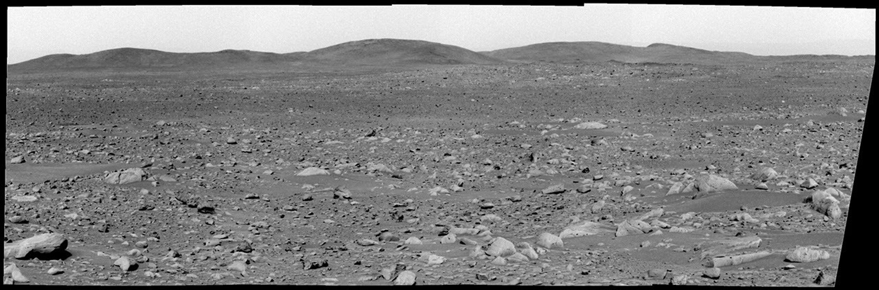 This image from NASA's Mars Exploration Rover Spirit panoramic camera shows the view acquired on the martian afternoon Apr. 3, 2004 in the direction of the rover's future drive destination. In the distance are the eastern-lying 'Columbia Hills.'