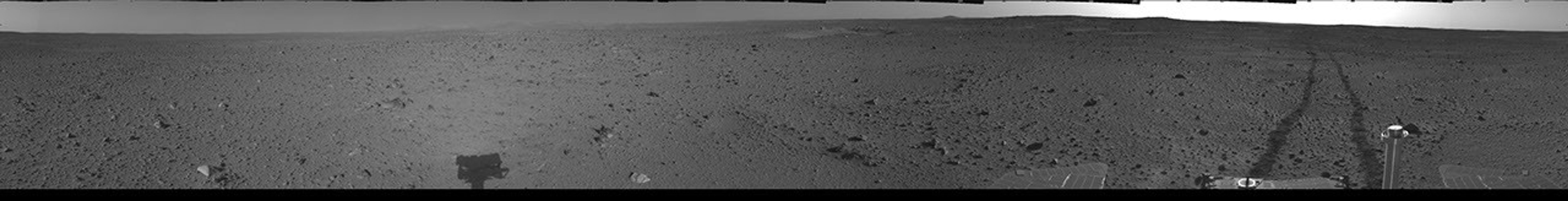 This cylindrical-projection mosaic was assembled from images taken by the navigation camera on the Mars Exploration Rover Spirit on April 24, 2004 at a region dubbed 'site 35.' Spirit is sitting 100 feet away from the northeast rim of 'Missoula' crater.