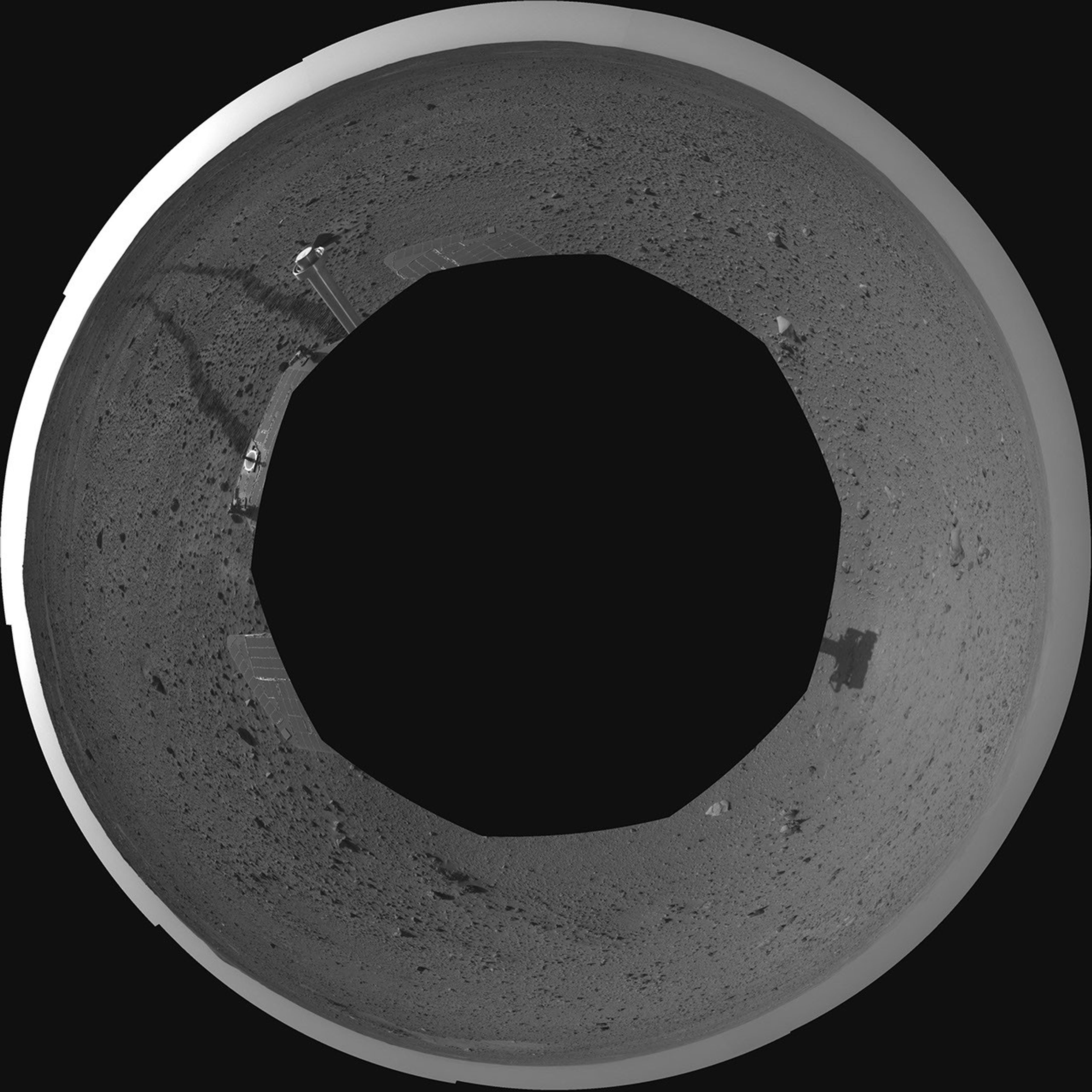 This polar-projection mosaic was assembled from images taken by the navigation camera on the Mars Exploration Rover Spirit on April 24, 2004 at a region dubbed 'site 35.' Spirit is sitting 100 feet away from the northeast rim of 'Missoula' crater.
