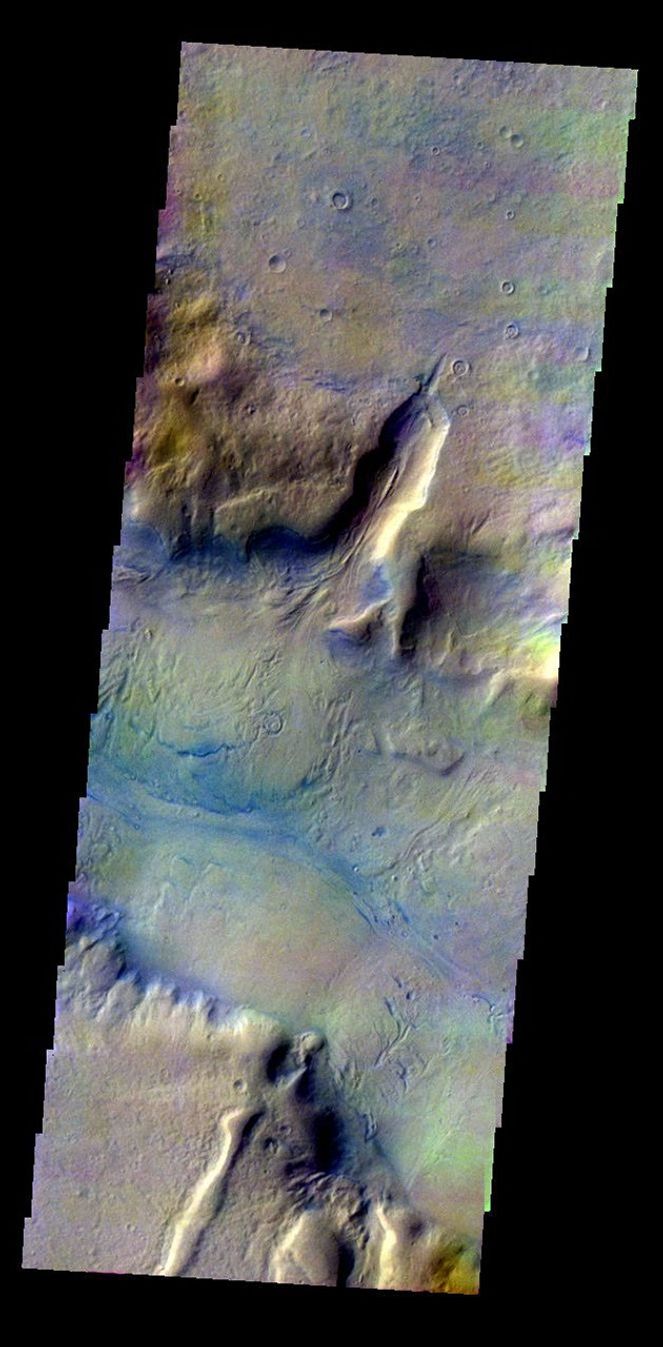 This color image from NASA's 2001 Mars Odyssey released on May 6, 2004 shows the martian surface during the southern summer season in Reull Vallis.