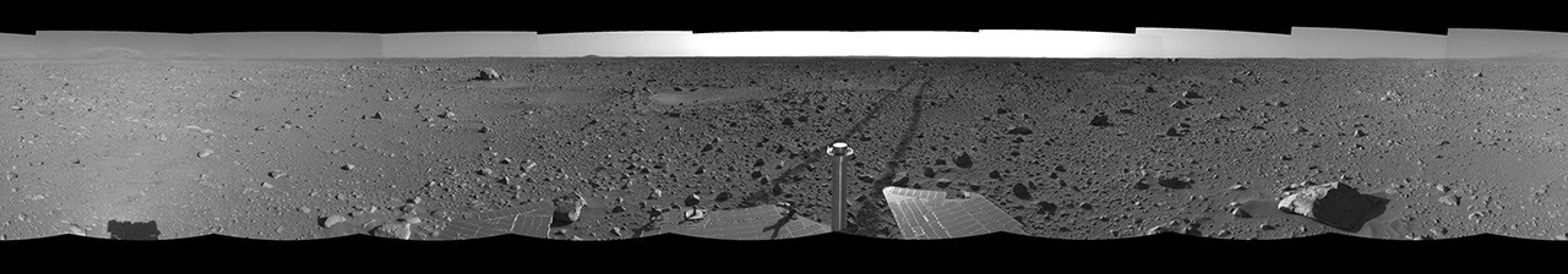 This left-eye view was created from navigation camera images that NASA's Mars Exploration Rover Spirit acquired on May 12, 2004. The tracks show the path the rover had traveled so far on its way to the base of the 'Columbia Hills.'