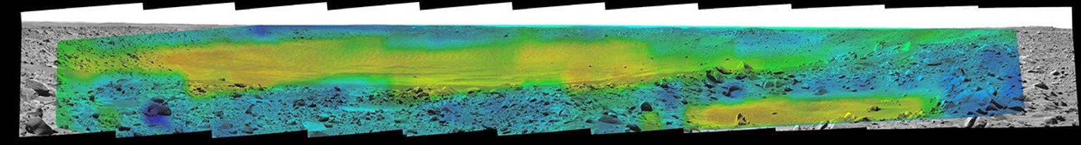 Temperature information from the miniature thermal emission spectrometer on NASA's Mars Exploration Rover Spirit is overlaid onto a view of the site from Spirit's panoramic camera indicating rates of change in surface temperatures during a martian day.