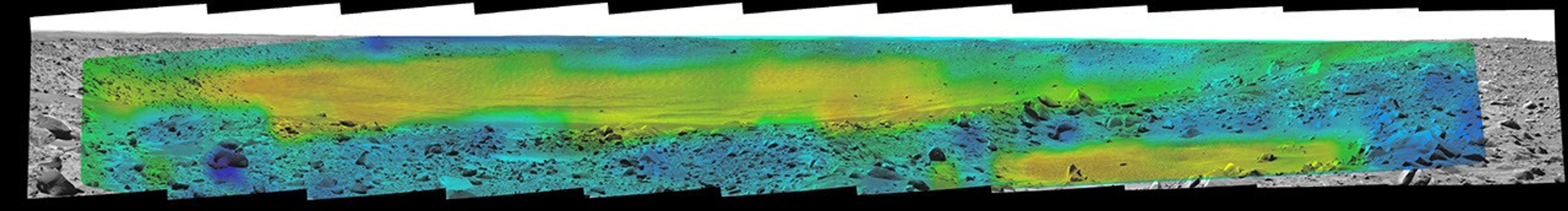 Temperature information from the miniature thermal emission spectrometer on NASA's Mars Exploration Rover Spirit is overlaid onto a view of the site from Spirit's panoramic camera indicating rates of change in surface temperatures during a martian day.