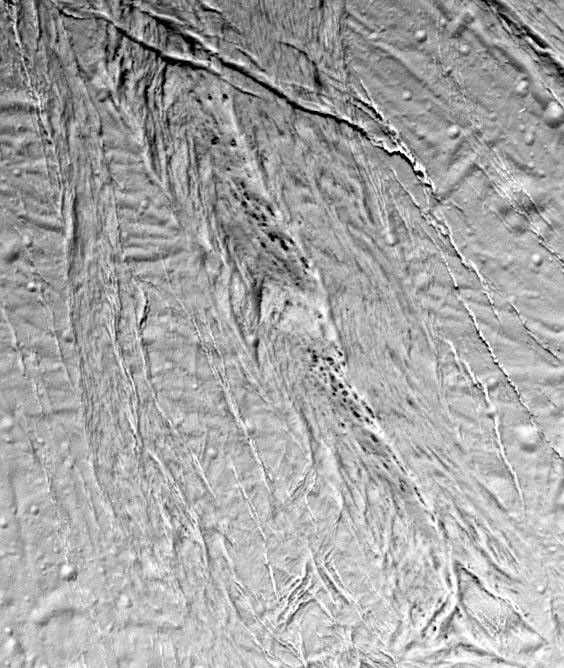 This high-resolution image from NASA's Cassini spacecraft shows a region of 'smooth plains' terrain on the surface of Saturn's moon Enceladus, located slightly north of the equator on the moon's Saturn-facing hemisphere.