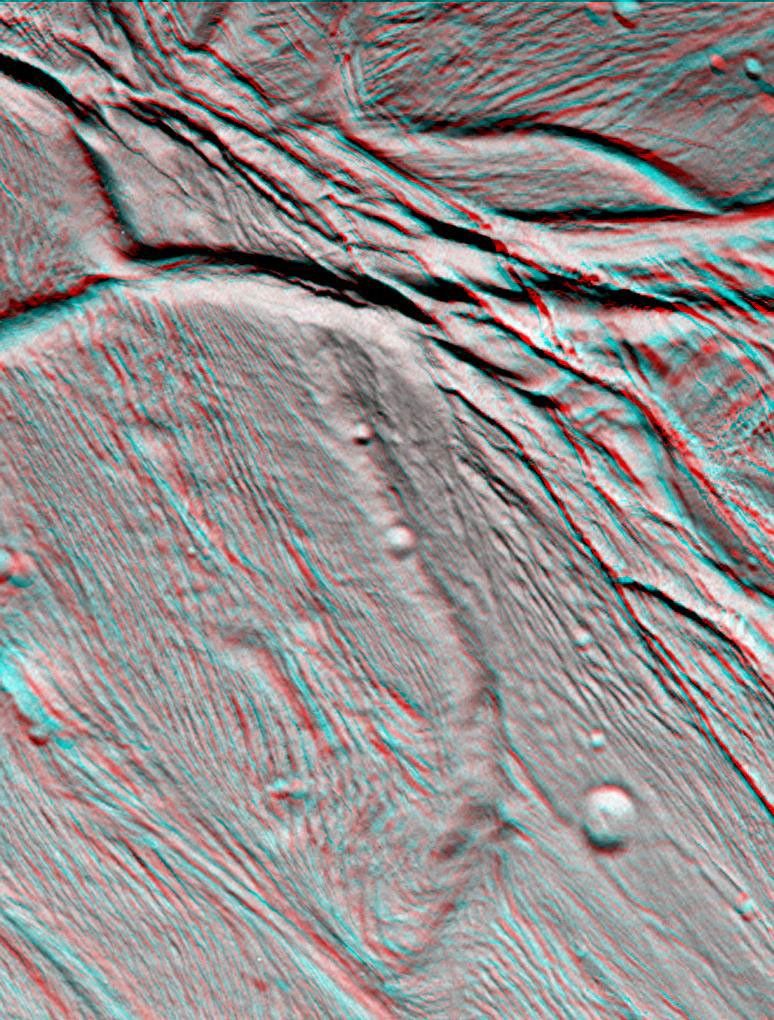 NASA's Cassini spacecraft took images of the ropy, taffy-like topography of Saturn's moon Enceladus from many different angles as the spacecraft flew by on Feb. 17, 2005. 3D glasses are necessary to view this image.