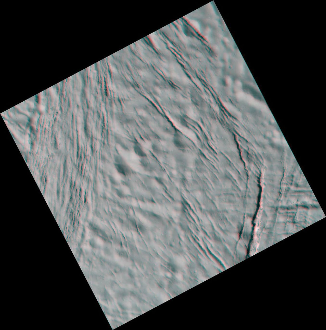 This high-resolution stereo anaglyph captured by NASA's Cassini spacecraft of Saturn's moon Enceladus shows a region of craters softened by time and torn apart by tectonic stresses. 3D glasses are necessary to view this image.