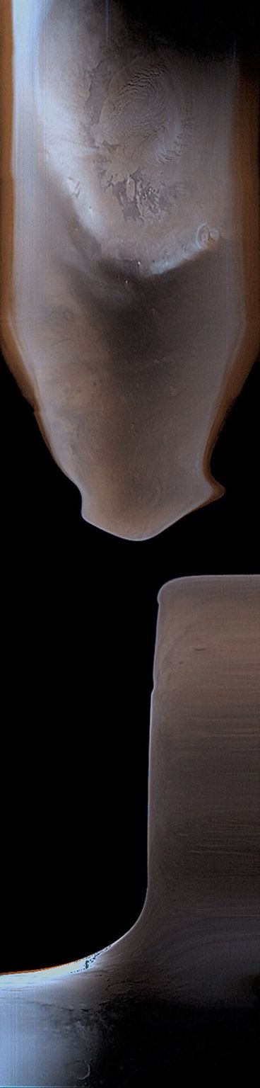 This image from NASA's Mars Global Surveyor shows the south polar region of Mars (bottom), and the north polar cap (top). Bluish areas are clouds in the atmosphere. The dark region immediately below the north polar cap is Acidalia Planitia.
