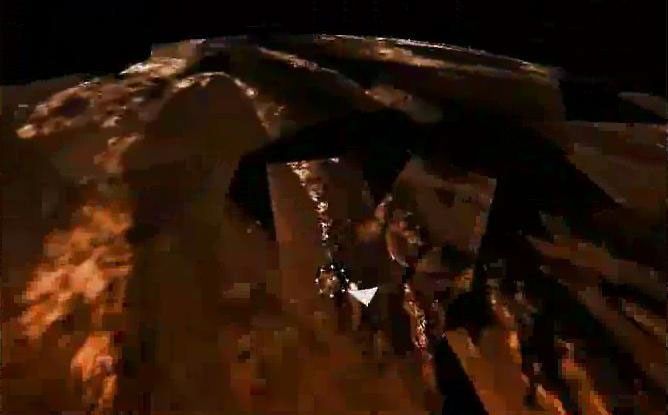 This frame from a movie shows a quick succession of multiple products of Titan's surface from NASA's Cassini orbiter and the European Space Agency's Huygens probe.