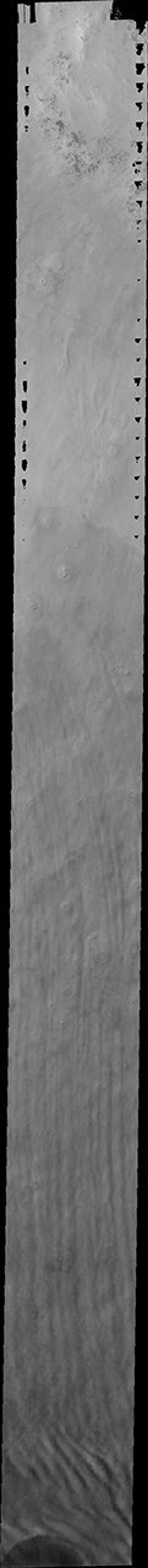 This image from NASA's 2011 Mars Odyssey spacecraft shows the North Polar water-ice clouds on Mars; the crater at the bottom of the image is causing a deflection in the linear form.
