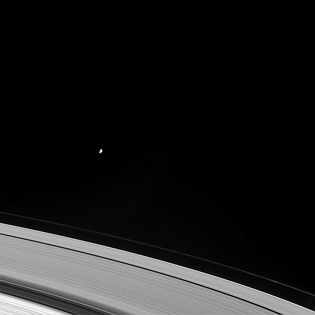 Mimas orbits beyond the outer fringes of Saturn's main rings, as shown in this image from NASA's Cassini spacecraft.