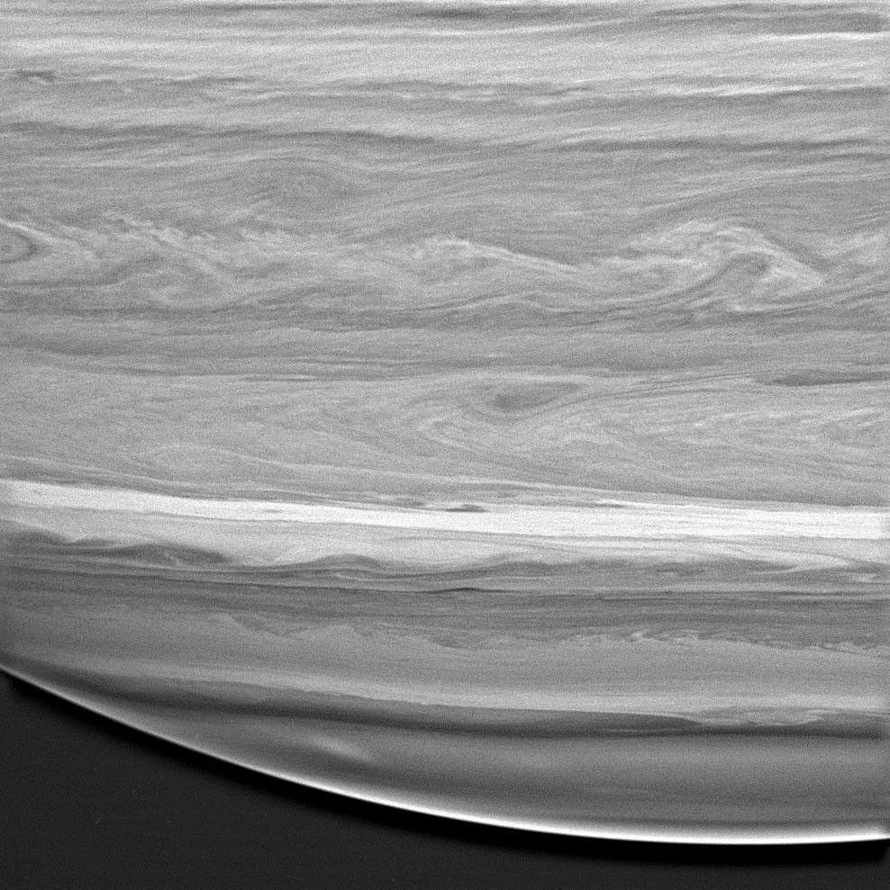 This image captured by NASA's Cassini spacecraft shows a highly detailed look at the feathery, wavelike patterns in the cloud bands of Saturn's southern hemisphere.
