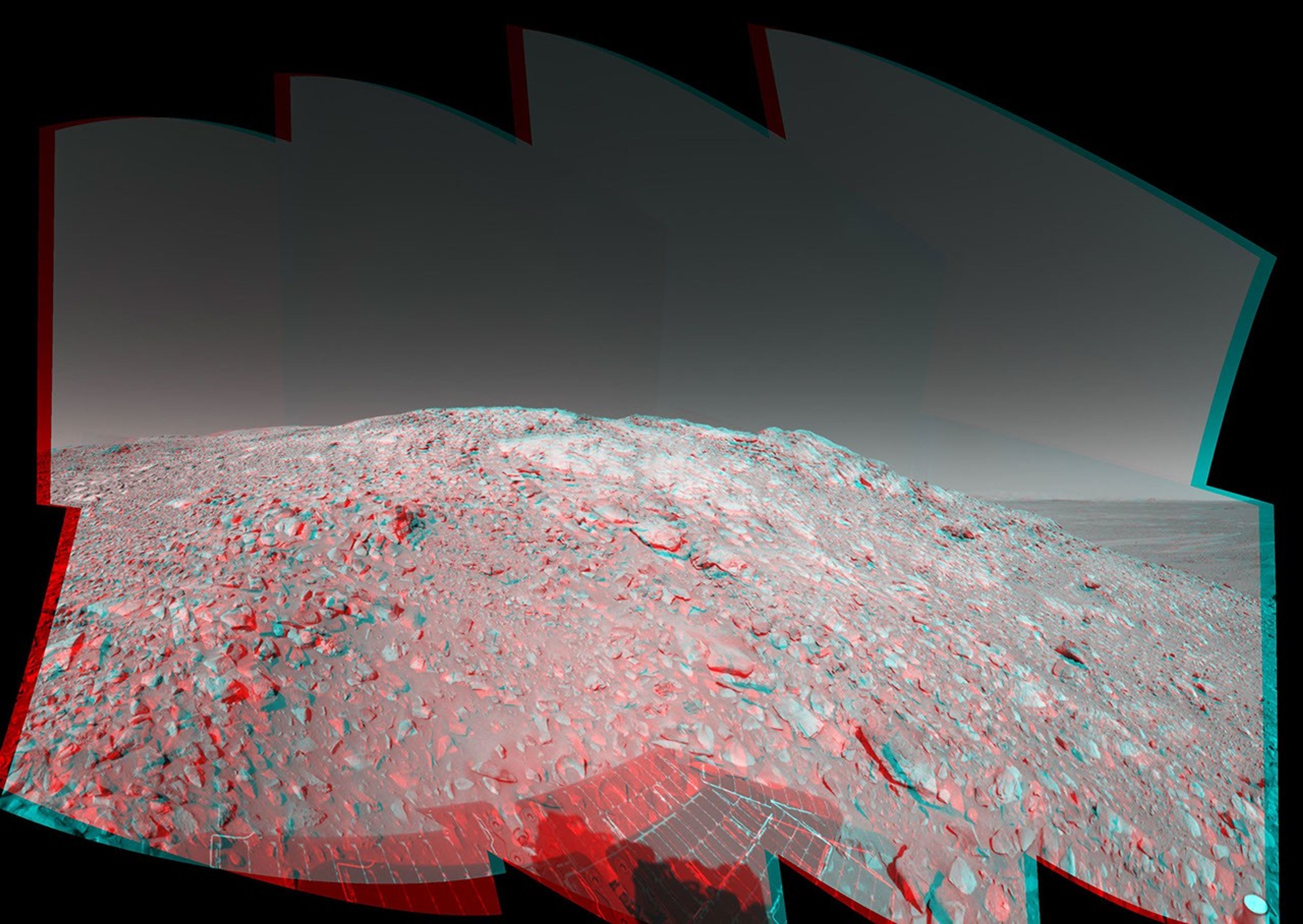 In this stereo image, a rock outcrop with a view of the surrounding landscape beckons NASA's Mars Exploration Rover Spirit on sol 203. 3D glasses are necessary to view this image.