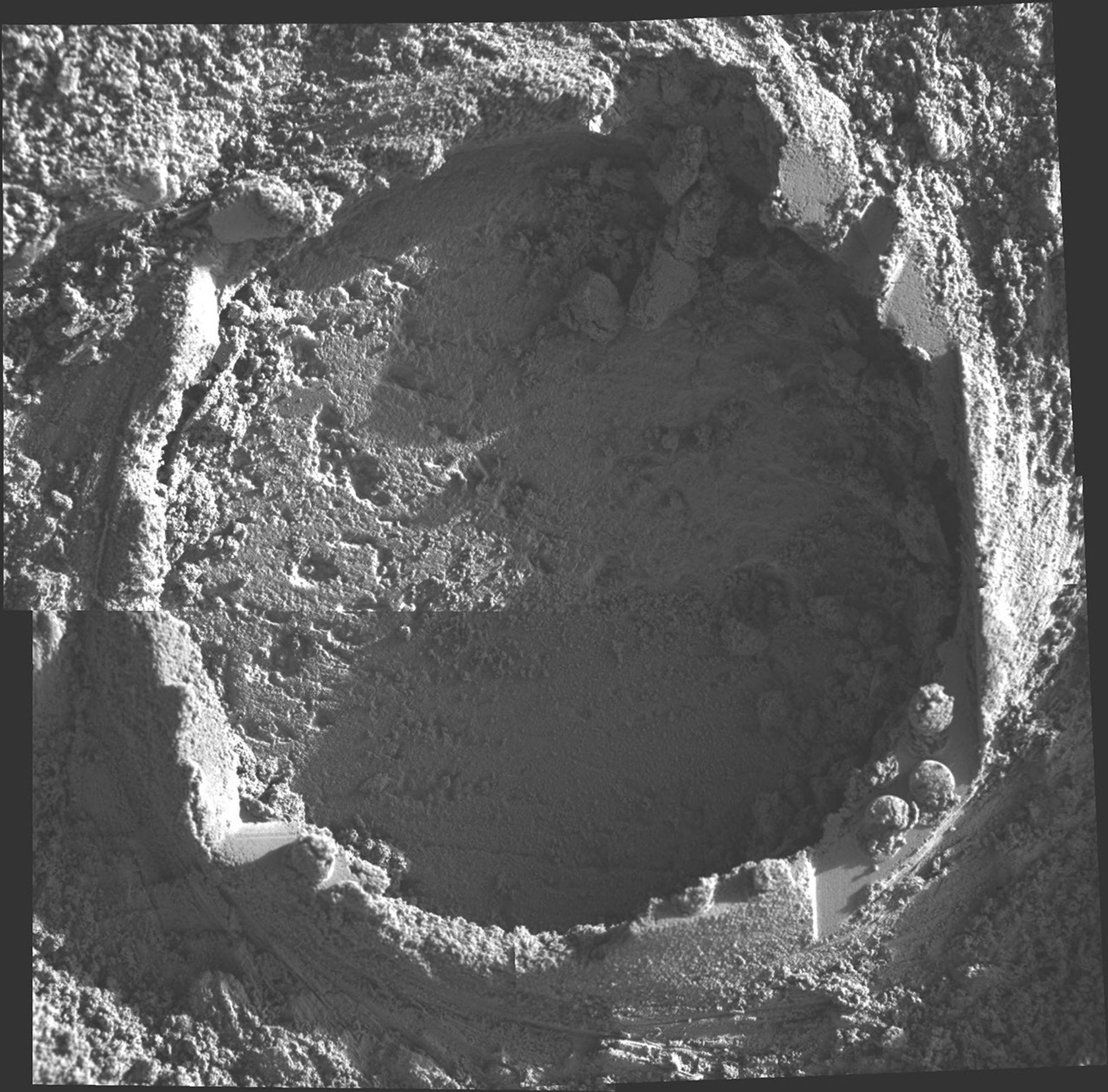 This mosaic was produced from pictures taken with the microscopic imager on NASA's Mars Exploration Rover Opportunity on June 29, 2004. It shows one of a series of holes ground by the rover's rock abrasion tool in 'Endurance Crater' on Mars.