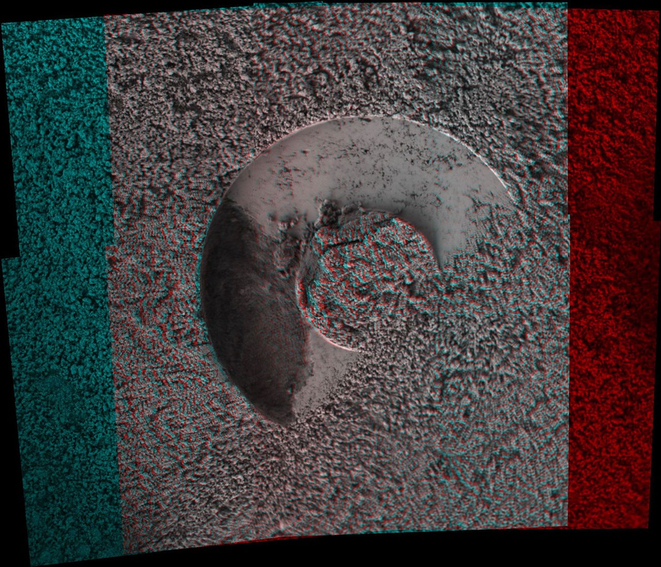 NASA's Mars Exploration Rover microscopic imager onboard Spirit revealed a gap less than half an inch in the imprint left behind in the soil. 3D glasses are necessary to view this image.