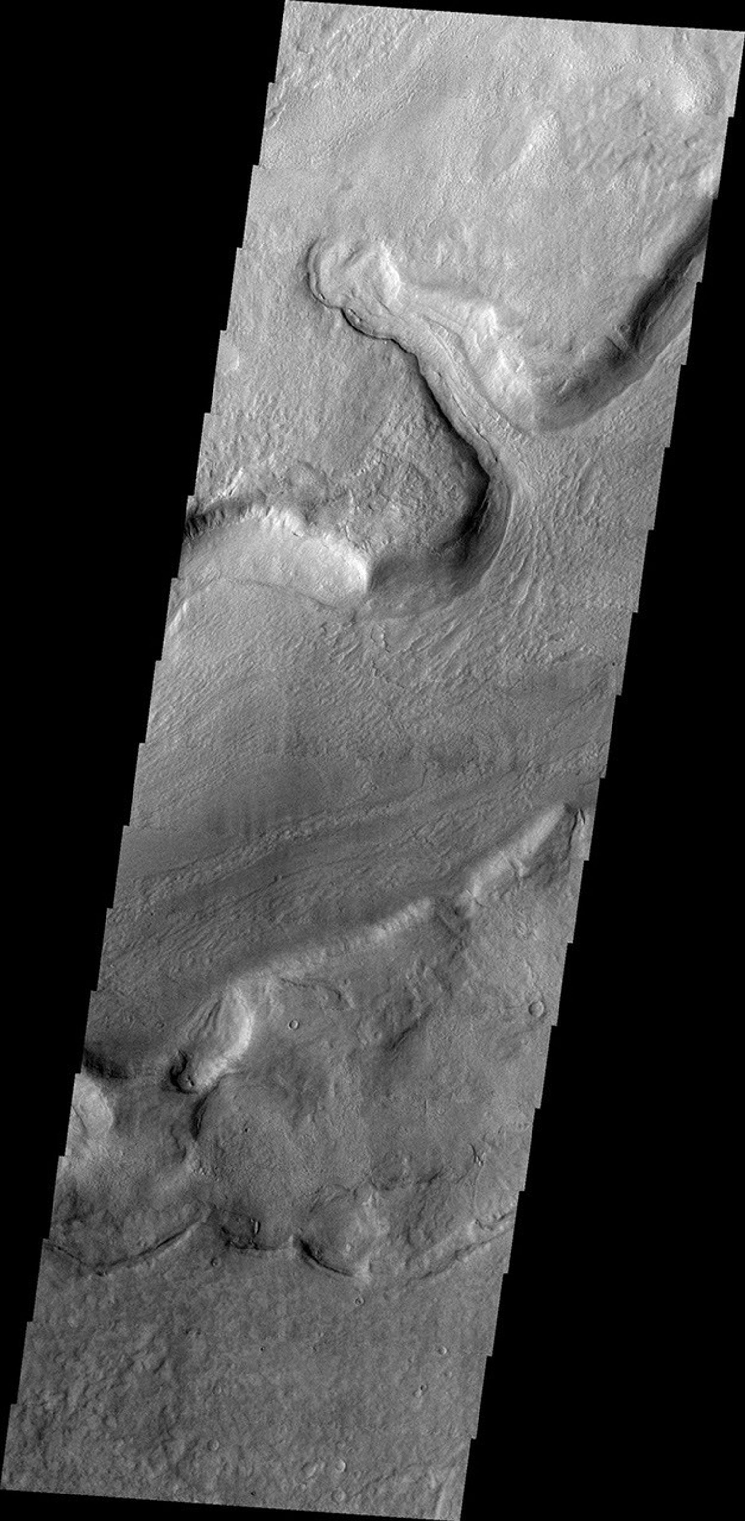 This image released on Oct 25, 2004 from NASA's 2001 Mars Odyssey shows Reull Vallis, located in the Martian southern highlands, just east of Hellas Basin.