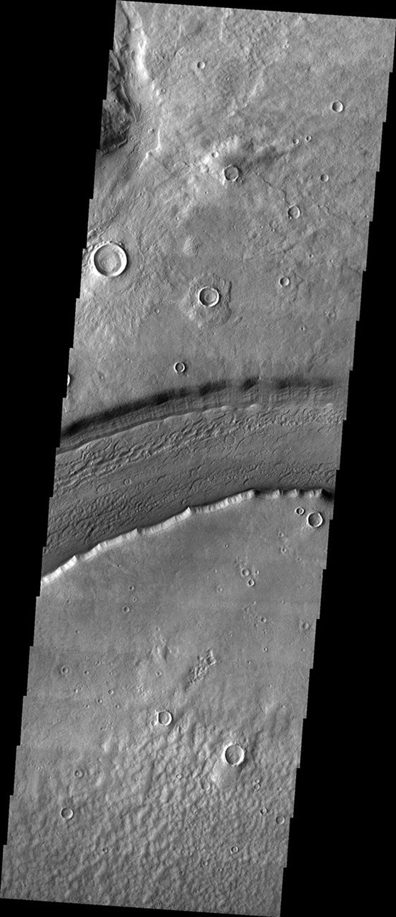 This image released on Oct 25, 2004 from NASA's 2001 Mars Odyssey shows Reull Vallis, located in the Martian southern highlands, just east of Hellas Basin.