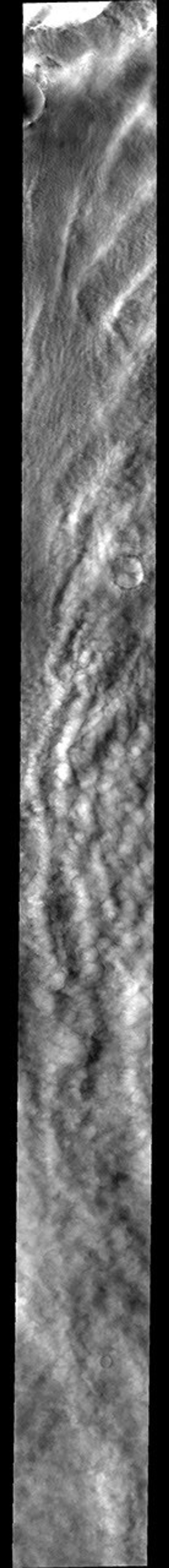 This image released on Nov 2, 2004 from NASA's 2001 Mars Odyssey shows clouds and one of the many storm fronts common in the north polar region during spring and early summer on Mars' polar cap.