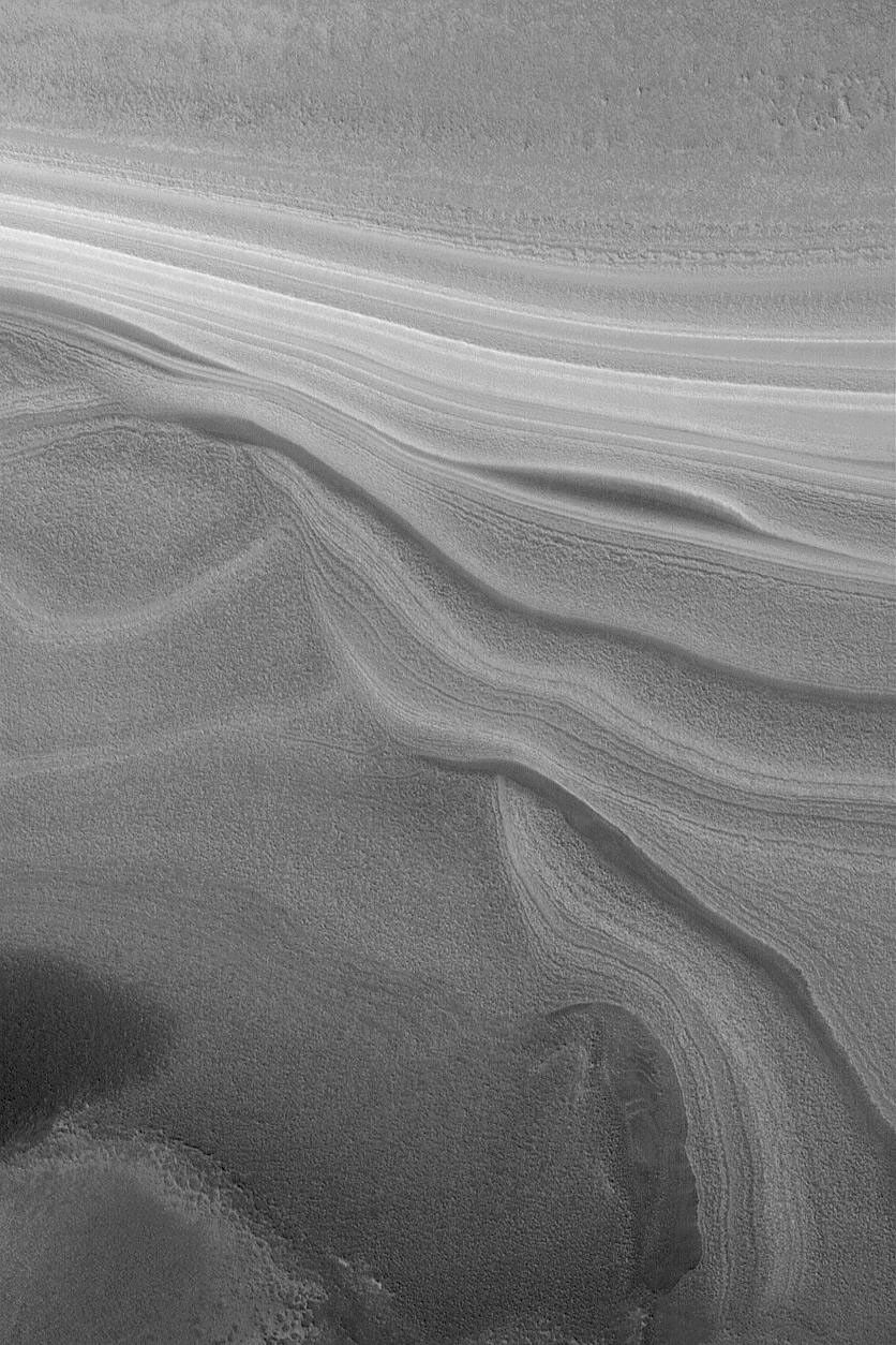 NASA's Mars Global Surveyor shows some of Mars' north polar layers exposed on a slope.