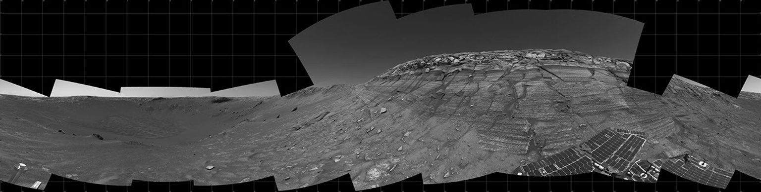 This image taken on Nov. 11, 2004, by NASA's Mars Exploration Rover Opportunity rock layers in the wall, with a portion of Opportunity's solar array visible at the bottom right.