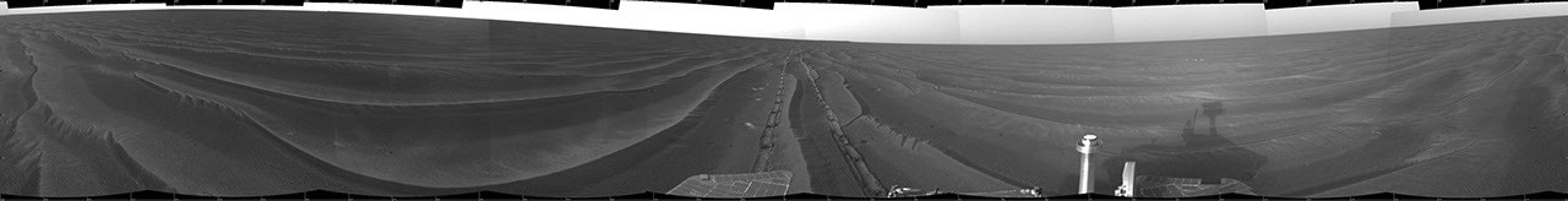 This cylindrical projection shows NASA's Mars Exploration Rover Opportunity's view of its surroundings on Feb. 19, 2005. Opportunity had reached the eastern edge of a small crater dubbed 'Naturaliste,' seen in the right foreground.
