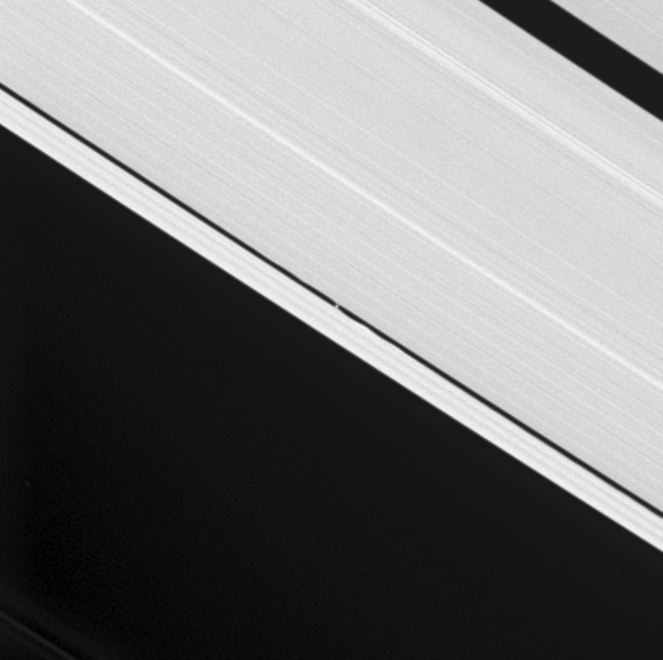 Cassini's cameras were retargeted to capture the tiny Keeler Gap moon S/2005 S1, visible at the center and first discovered by NASA's Cassini spacecraft a few months ago.