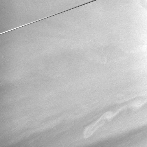 Subtle features in Saturn's equatorial region and the nearly edge-on rings are captured in this view NASA's Cassini spacecraft.