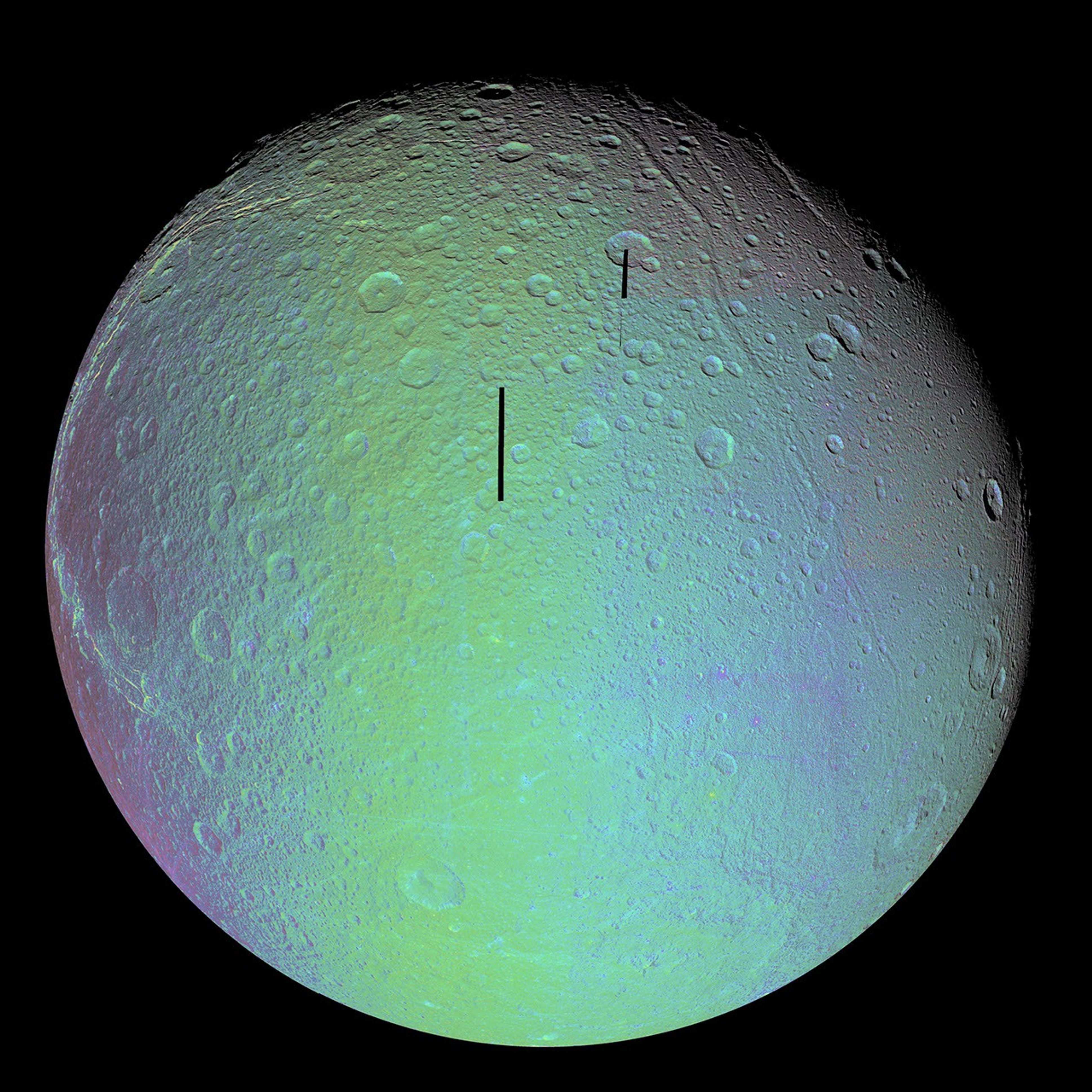 The cratered and cracked disk of Saturn's moon Dione looms ahead in this mosaic of images taken by NASA's Cassini spacecraft on Oct. 11, 2005, as it neared its close encounter with the icy moon.