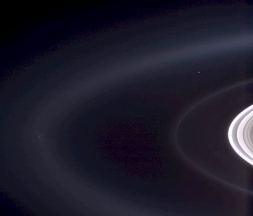 Cassini casts powerful eyes on our home planet, and captures Earth, a pale blue orb -- and a faint suggestion of our moon -- among the glories of the Saturn system.