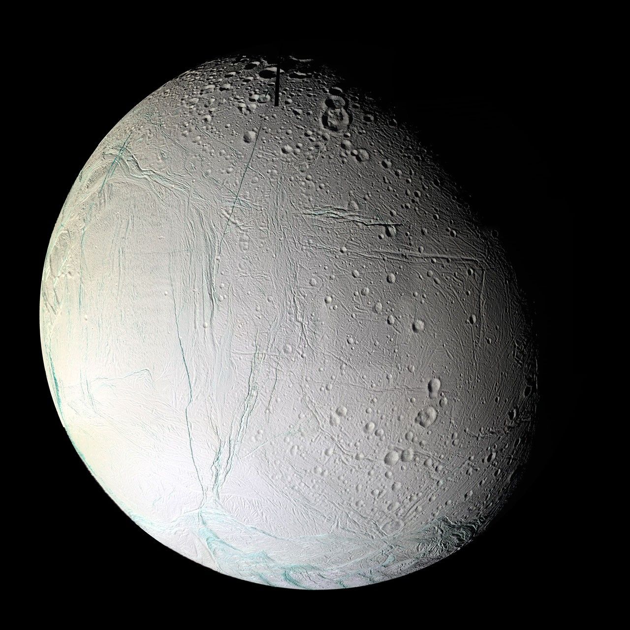 Numerous blue-green fractures can be seen in this false-color mosaic taken during NASA's Cassini's second close flyby of Enceladus, on March 9, 2005.