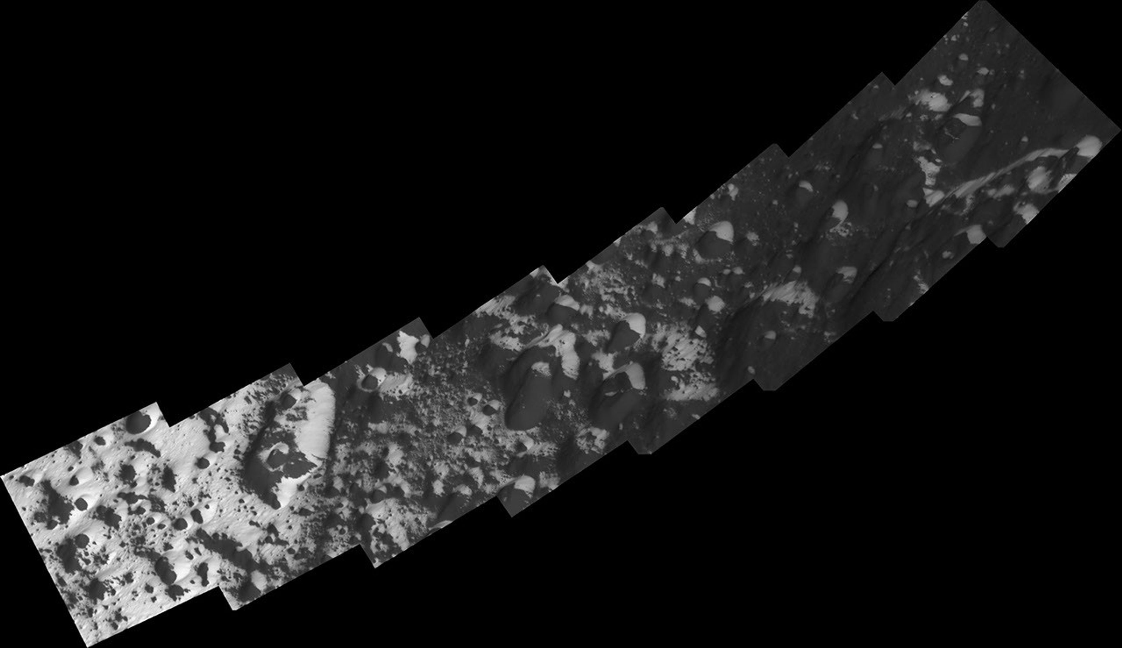 Soaring above the alien, icy wastelands of Saturn's moon Iapetus, NASA's Cassini spacecraft captured this image of the transition region from dark to bright terrain at southern middle latitudes that have been mosaicked together in this view.