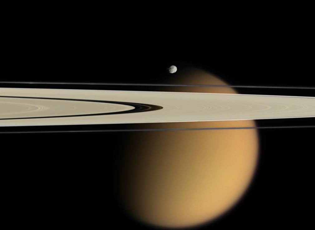 NASA's Cassini spacecraft delivers this stunning vista showing small, battered Epimetheus and smog-enshrouded Titan, with Saturn's A and F rings stretching across the scene.