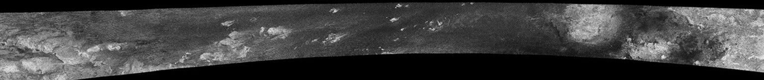 This image was taken with NASA's Cassini Synthetic Aperture Radar instrument on Oct. 28, 2005. This was the fourth flyby of Titan during which radar images were obtained. The most ubiquitous features in this swath are "cat scratches.'